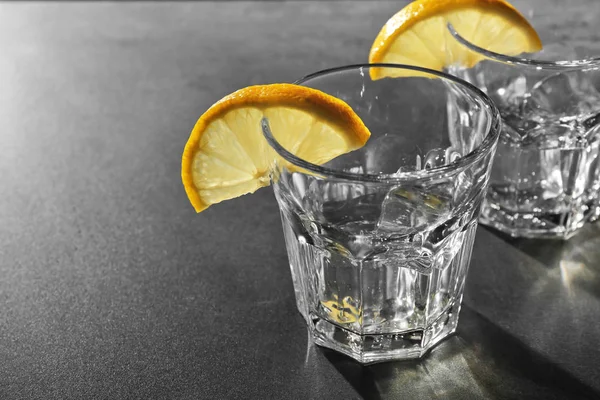 Glasses of vodka with lemon — Stock Photo, Image