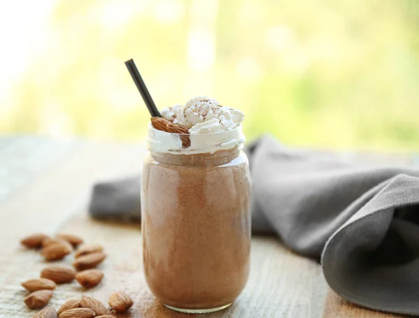 Fresh milkshake with cream and almond — Stock Photo, Image