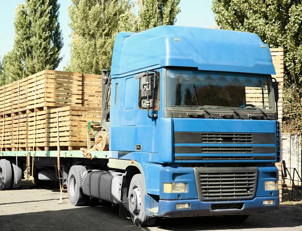 Truck carrying empty wooden crates