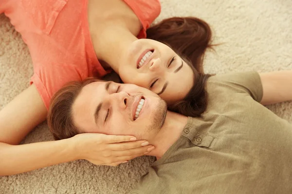 Lovely couple relaxing on floor — Stock Photo, Image