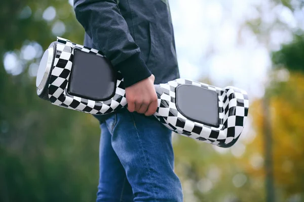 Teenager with gyroscooter in park — Stock Photo, Image