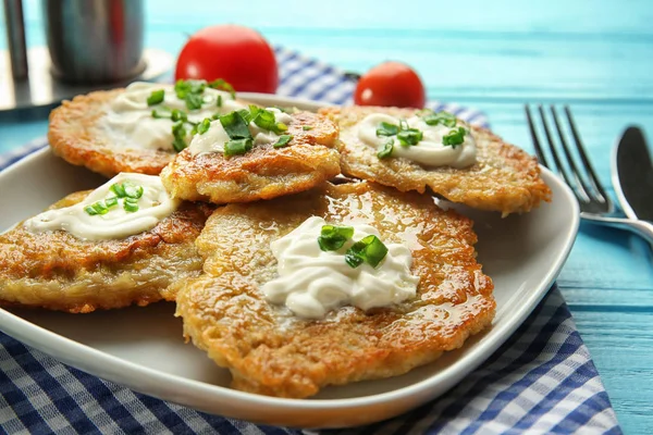 Plate with tasty potato pancakes — Stock Photo, Image