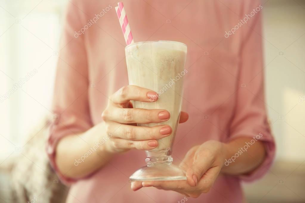 Woman holding milk shake