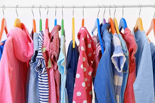 Clothes hanging on rack, closeup — Stock Photo, Image