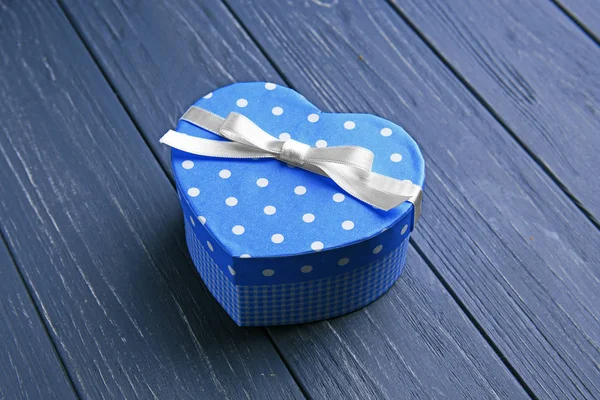 Heart shaped gift box on wooden table — Stock Photo, Image