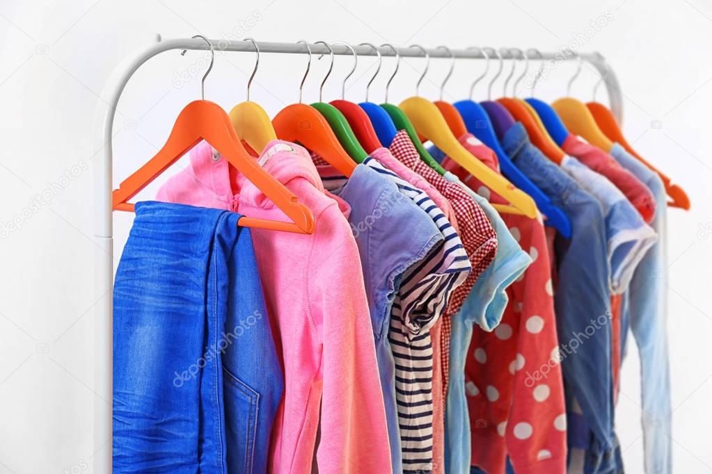 Clothes hanging on rack, closeup