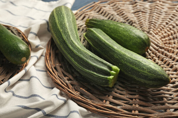 Fresh squash on wicker mat