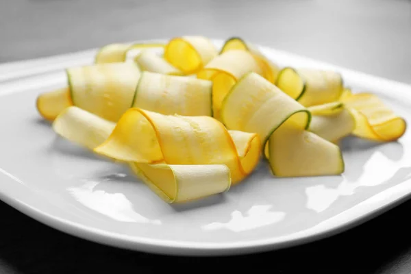 Slices of zucchini on white plate — Stock Photo, Image