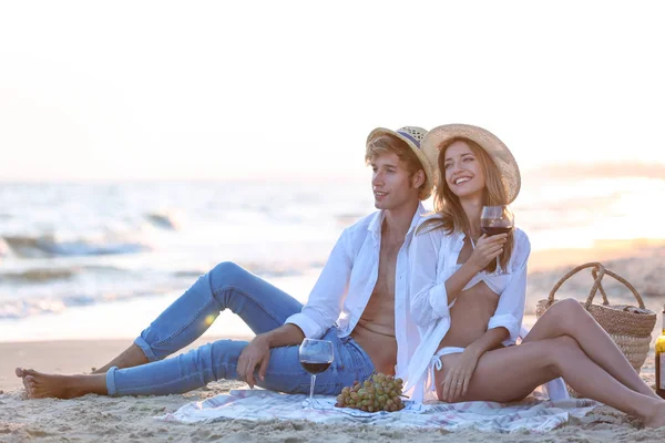 Young happy couple having date on seashore — Stock Photo, Image
