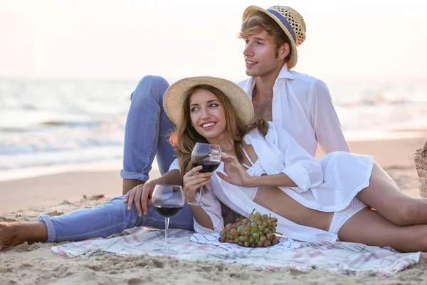Young happy couple having date on seashore — Stock Photo, Image