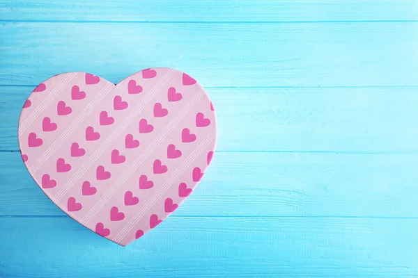 Heart shaped gift box on blue background — Stock Photo, Image
