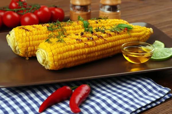 Grilled corns with ingredients on plate — Stock Photo, Image