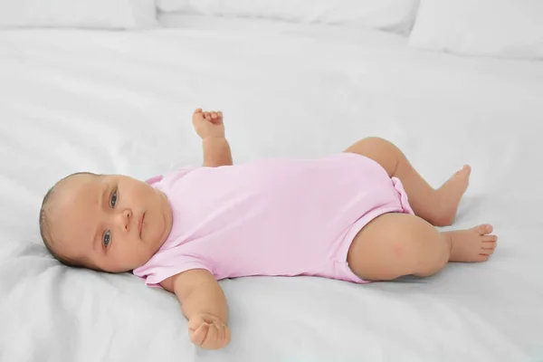 Cute baby lying on bed — Stock Photo, Image