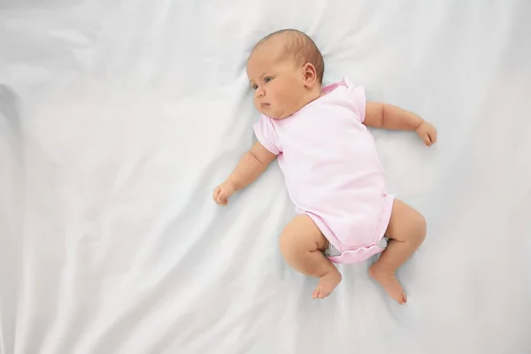 Cute baby on bed, top view — Stock Photo, Image