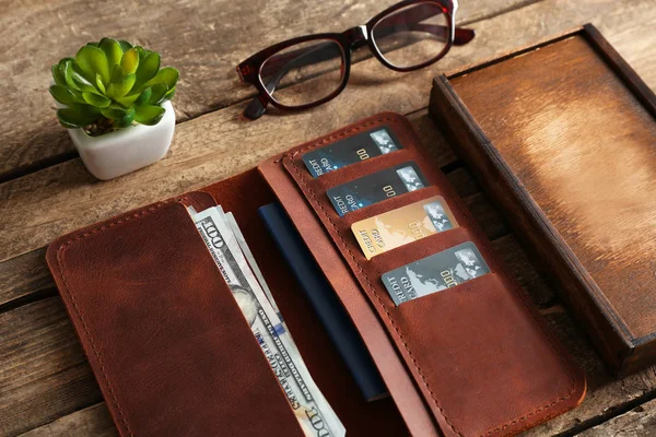 Leather wallet and glasses — Stock Photo, Image