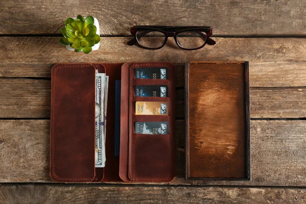 Leather wallet and glasses — Stock Photo, Image