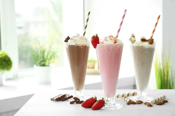 Delicious milkshakes in glasses — Stock Photo, Image