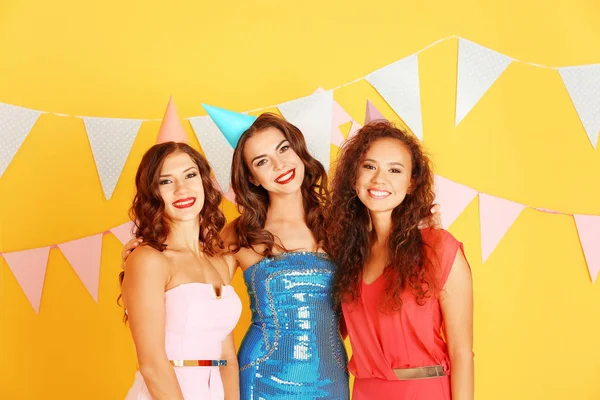 Beautiful Young Women Party Caps Yellow Background — Stock Photo, Image