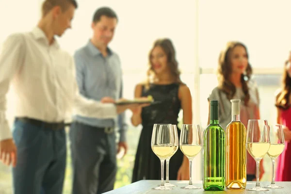 Bottles Glasses White Wine Table Blurred Party Background — Stock Photo, Image