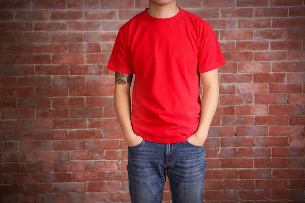 Young man in blank red t-shirt