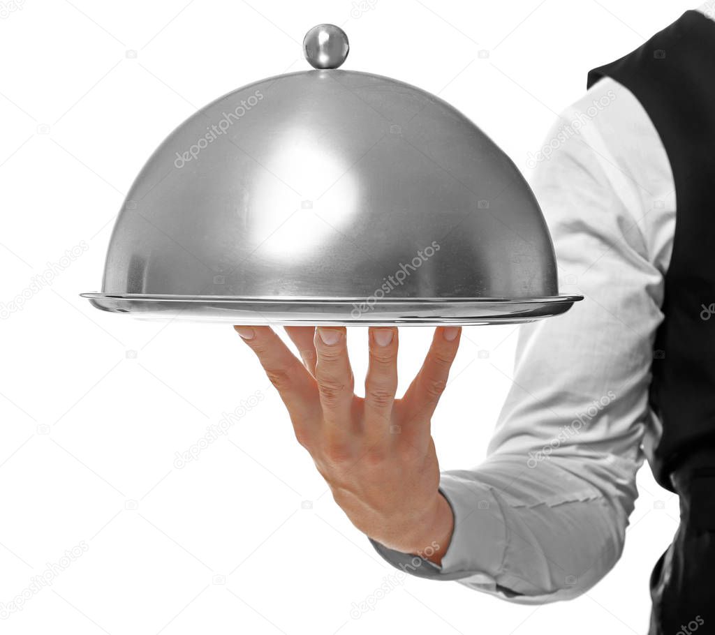 Waiter holding metal tray 