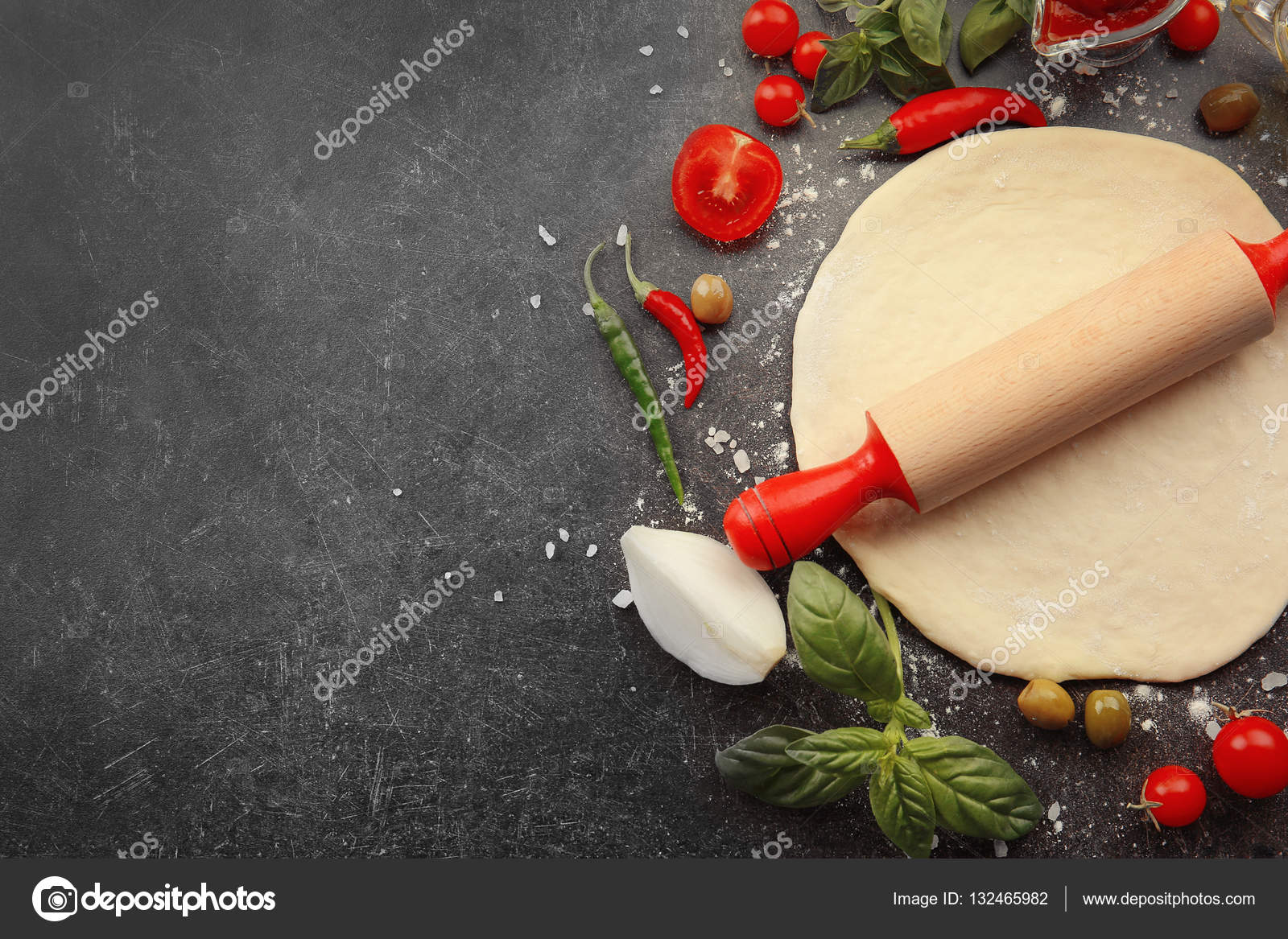 Raw pizza dough with ingredients — Stock Photo © belchonock 132465982