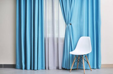 Chair and room window with curtains clipart