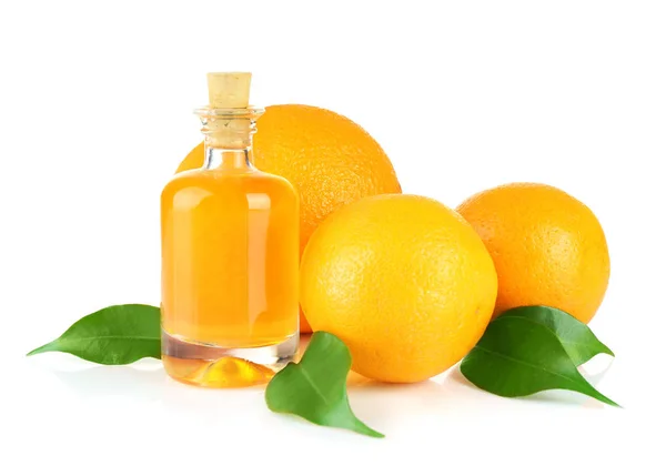 Naranjas y botella con aceite esencial —  Fotos de Stock