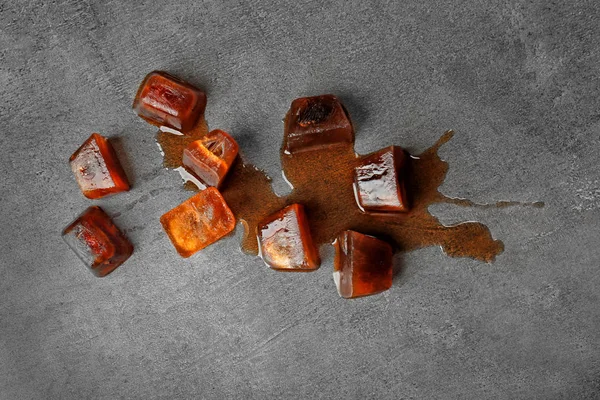 Iced coffee cubes on grey — Stock Photo, Image