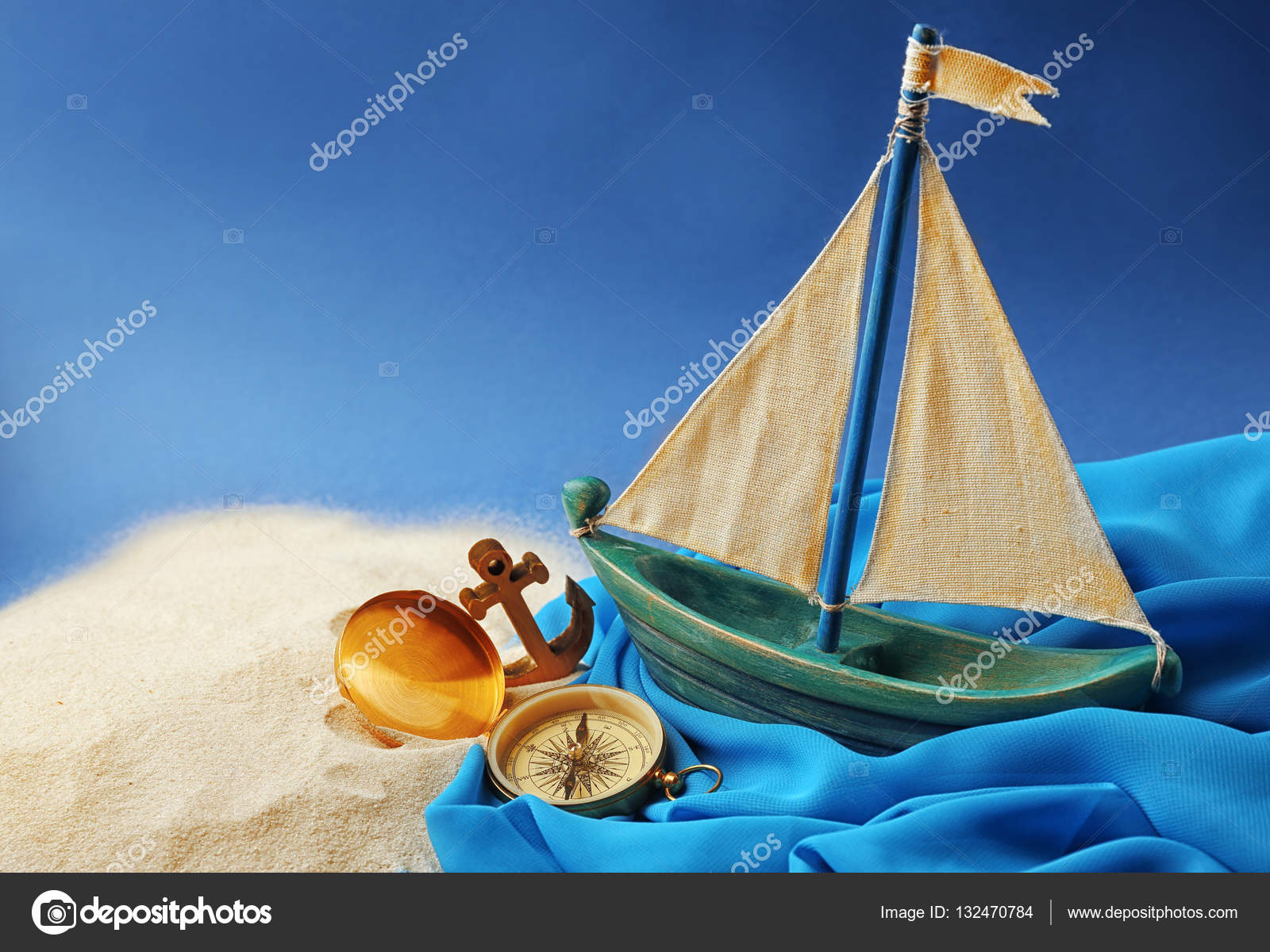 Wooden boat, compass and anchor — Stock Photo © belchonock 132470784