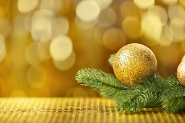 Bauble and coniferous branch — Stock Photo, Image