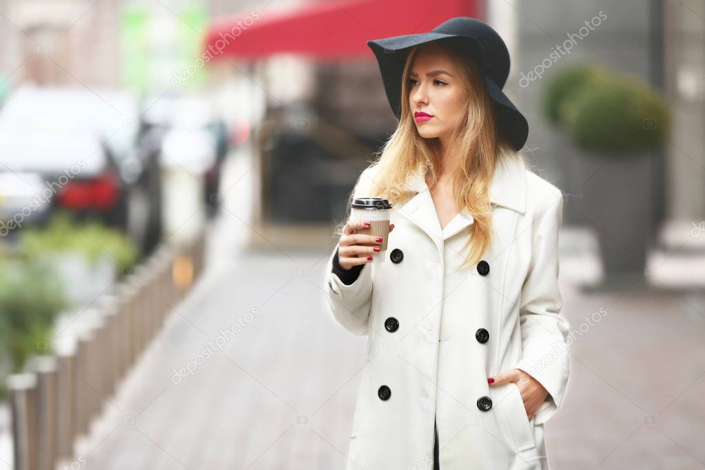 Fashion woman with cup of coffee