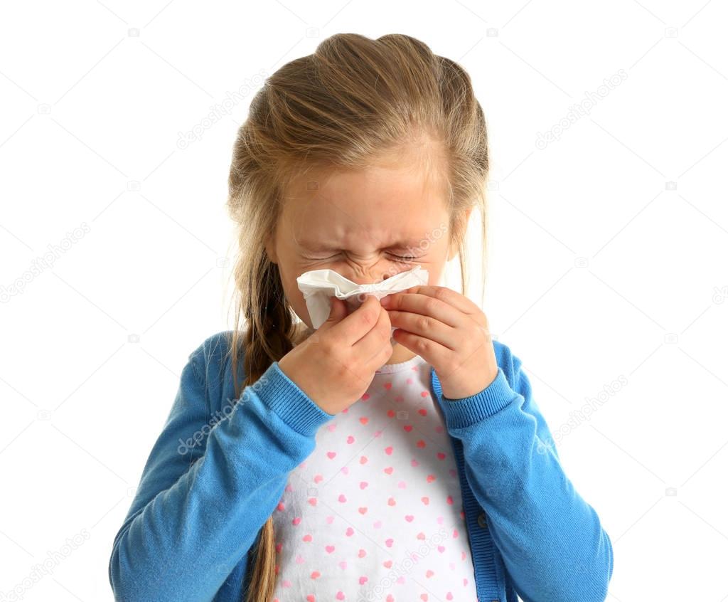 Cute little girl blowing nose  