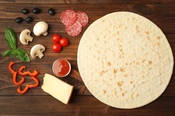 Pizza ingredients on wood — Stock Photo, Image