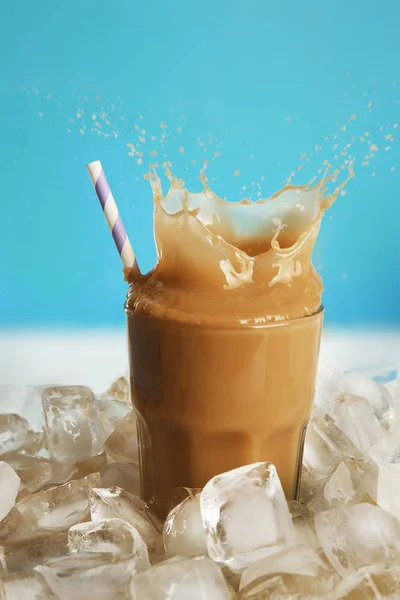 Glass of cold coffee with ice cubes — Stock Photo, Image