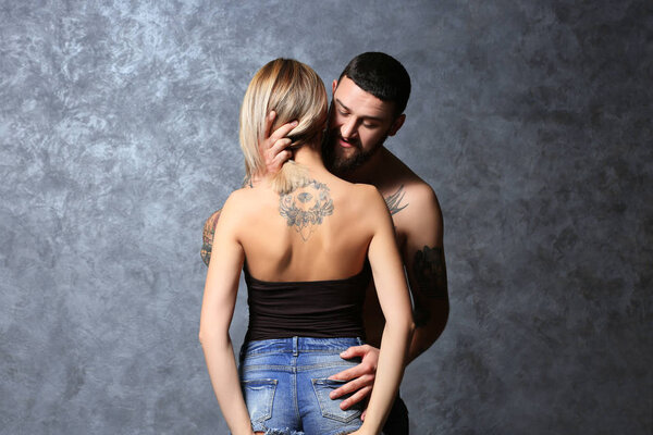 Passion tattooed beautiful couple 