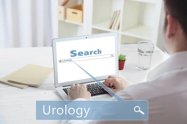 Man searching information with Word UROLOGY — Stock Photo, Image