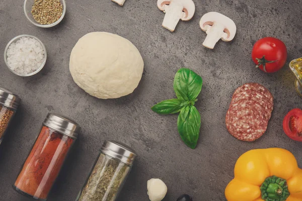 Raw dough for pizza with ingredients — Stock Photo, Image