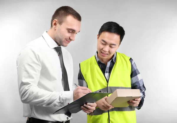 Handsome Man Warehouse Worker Cardboard Box Light Background — Stock Photo, Image