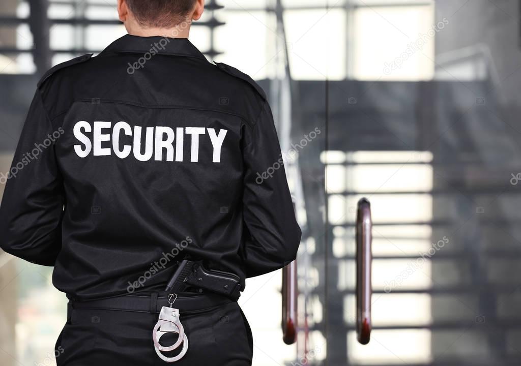 Security man standing back