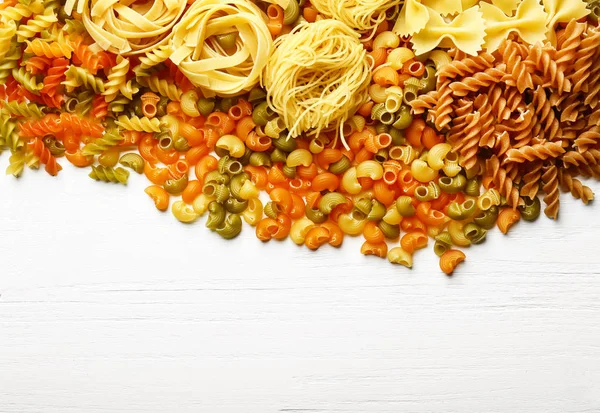 Raw pasta on table — Stock Photo, Image