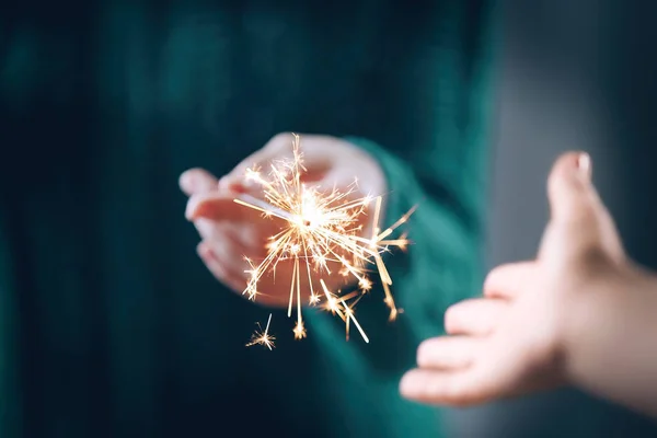 View of hand with sparkler — Stock Photo, Image