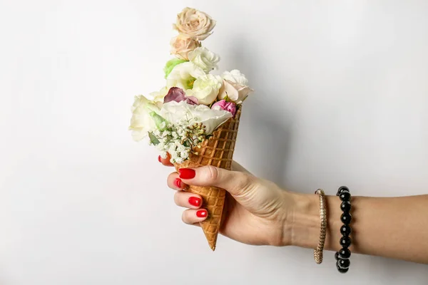 hand holding waffle cone