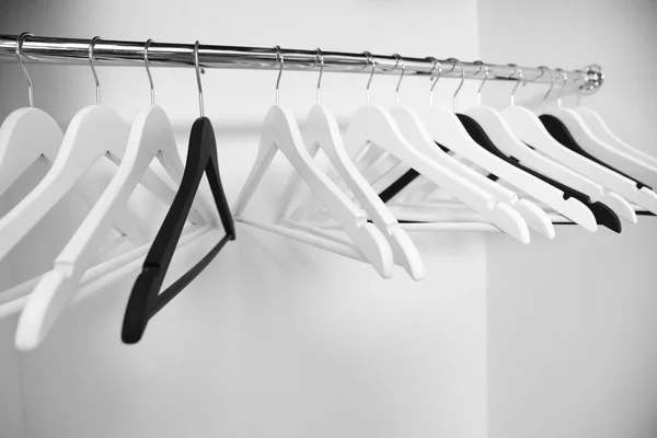 Clothes hangers in wardrobe — Stock Photo, Image