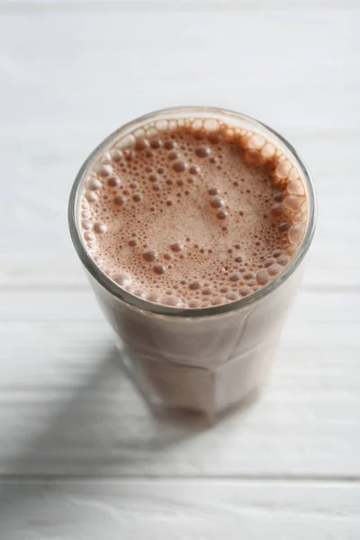 Delicious milkshake on wooden table — Stock Photo, Image