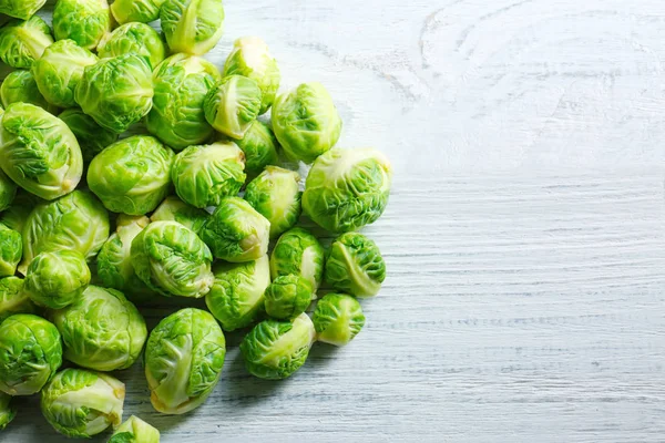 Brussels sprouts on wooden table — Stock Photo, Image