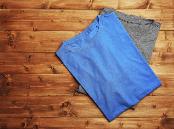 Blank blue and grey t-shirts — Stock Photo, Image