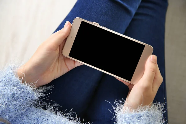 Woman holding modern cellphone — Stock Photo, Image