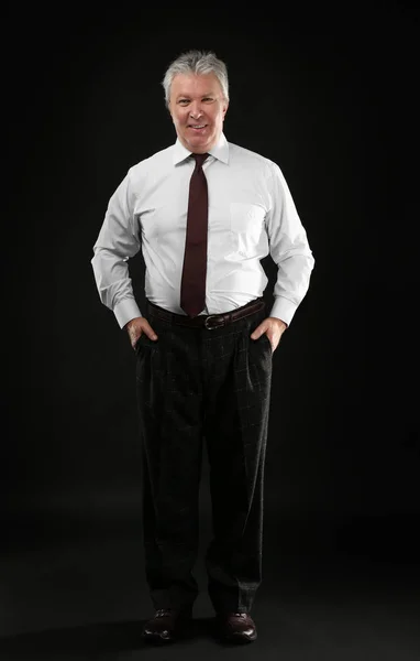 Senior businessman on black — Stock Photo, Image