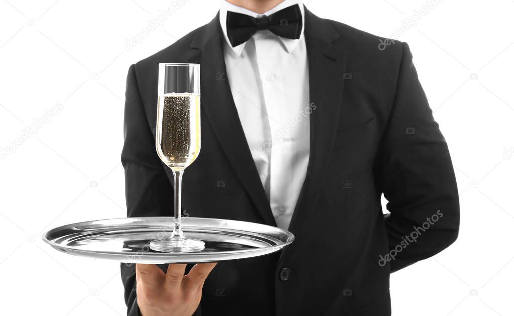 Male waiter holding tray with champagne